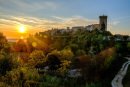 Airbnb Borghi Italiani: Moresco and its hilltop tower at sunset