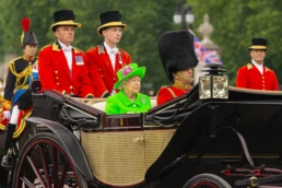 Queen Elizabeth 90th birthday: state carriage with royal footmen en route to Buckingham Palace
