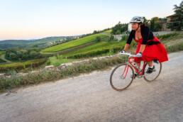 L'Eroica vintage cycling rider on a gravel strada bianca in the Chianti countryside